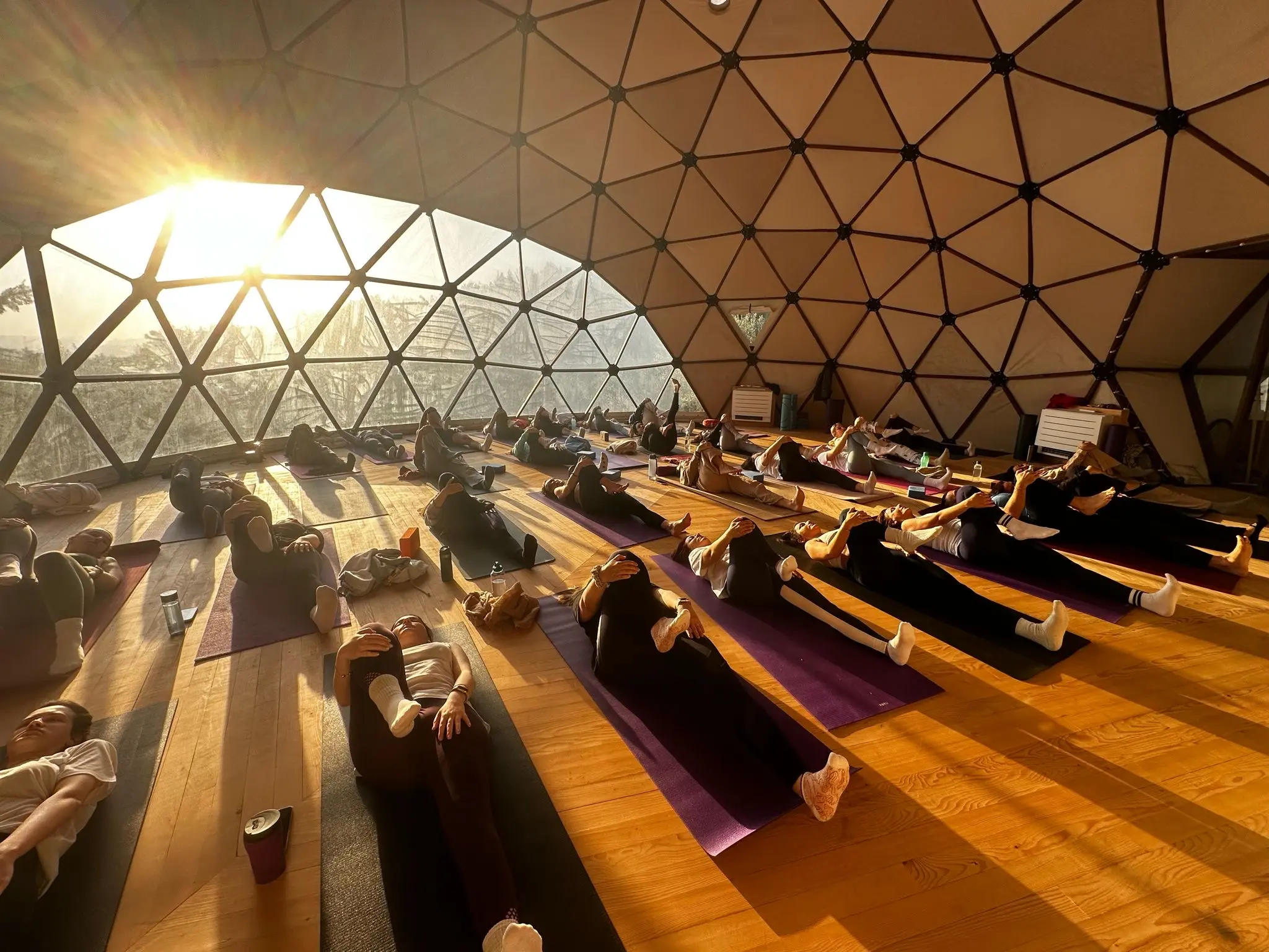 Sunrise savasana in the geodesic yoga dome at Çeşmeköy, a yoga retreat center near Çeşme, Turkey